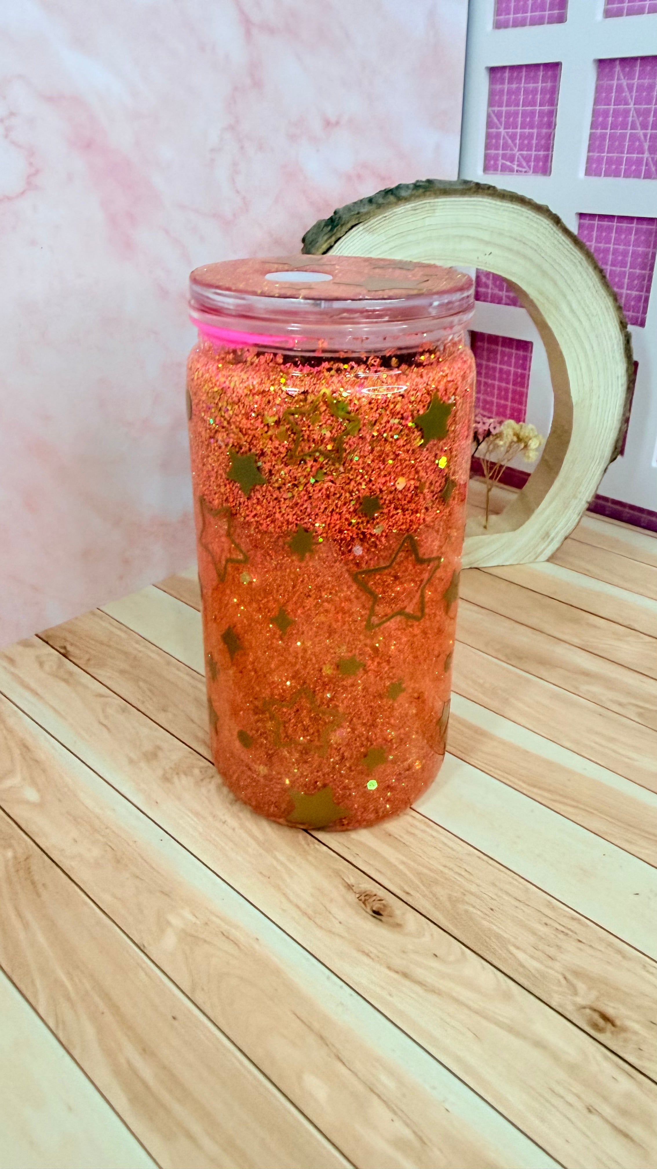 Vaso snowglobe naranja de estrellas